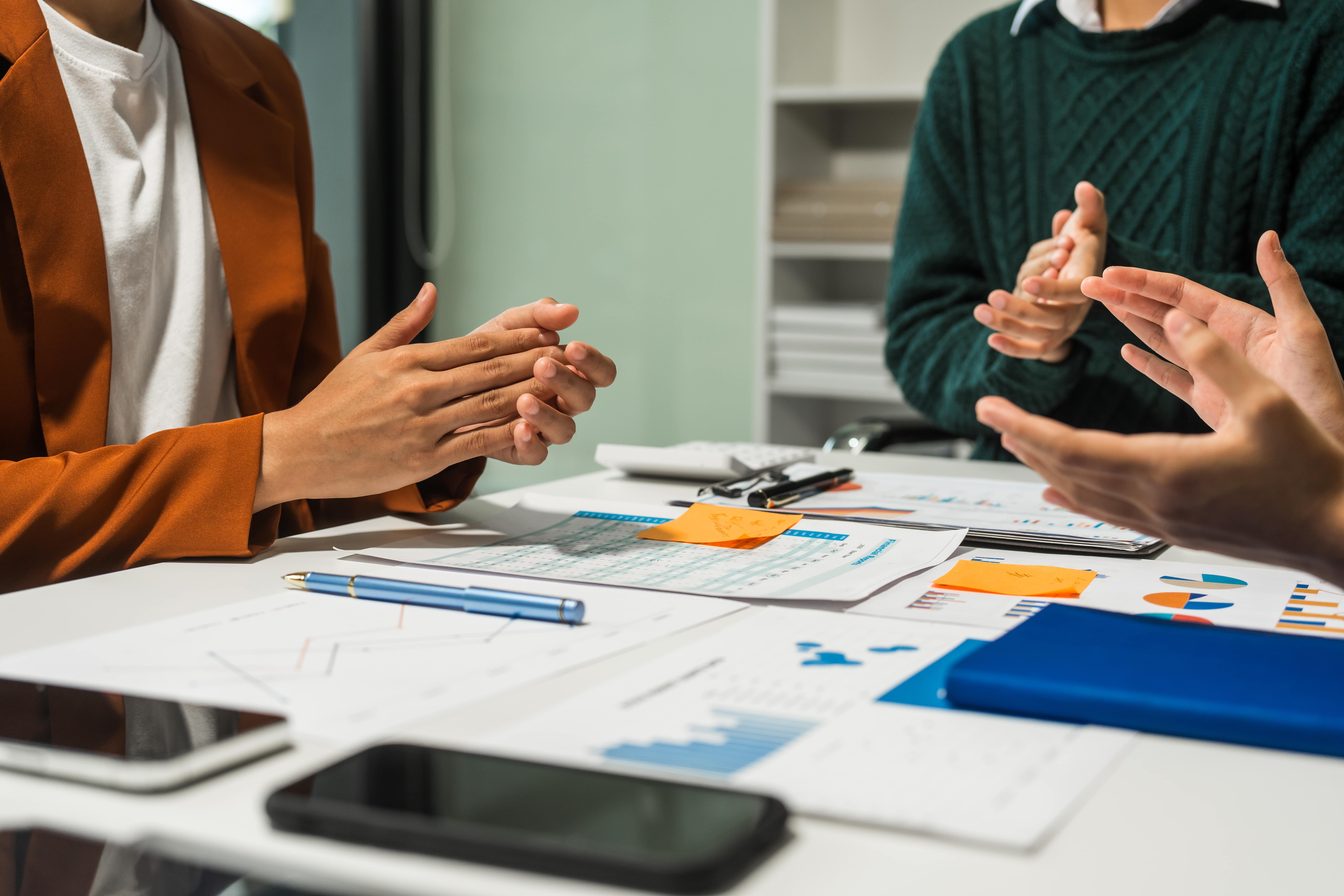 Team planning a product launch around a table