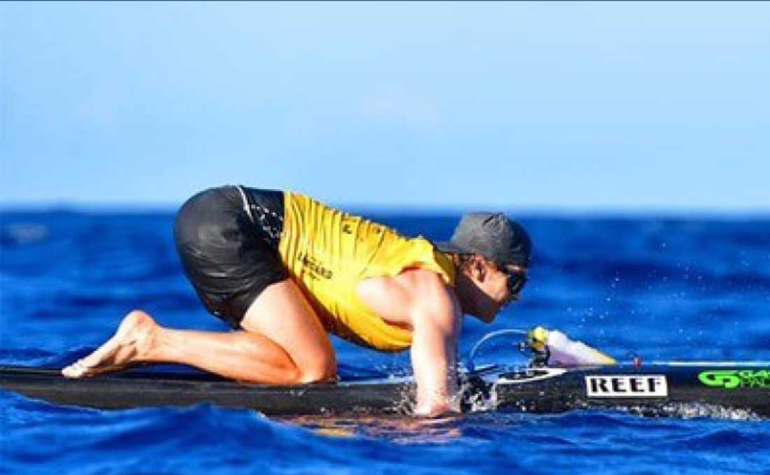 Surfer paddling with SurfScreen protection